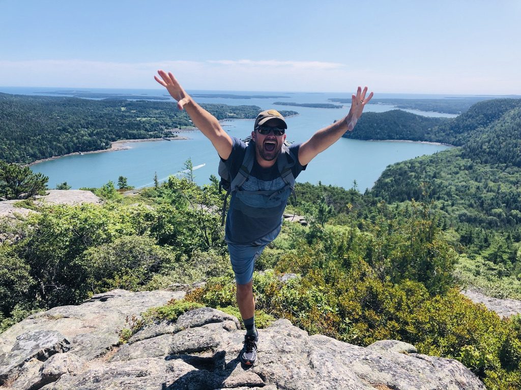My husband reaching the summit of Acadia Mountain Path overlooking Sommes Sound!