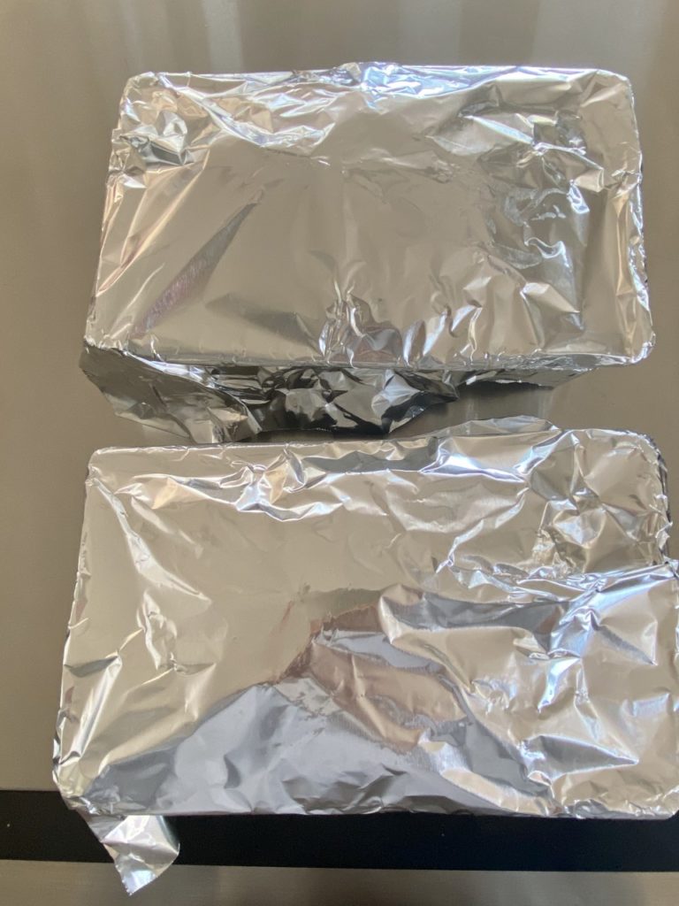 Pans are covered with aluminum foil to prevent over-browning. 