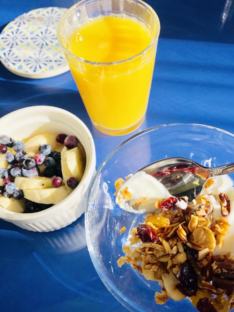House-made granola, yogurt & juice awaits guests as the beginning part of a very special breakfast at the Yellow House B & B.