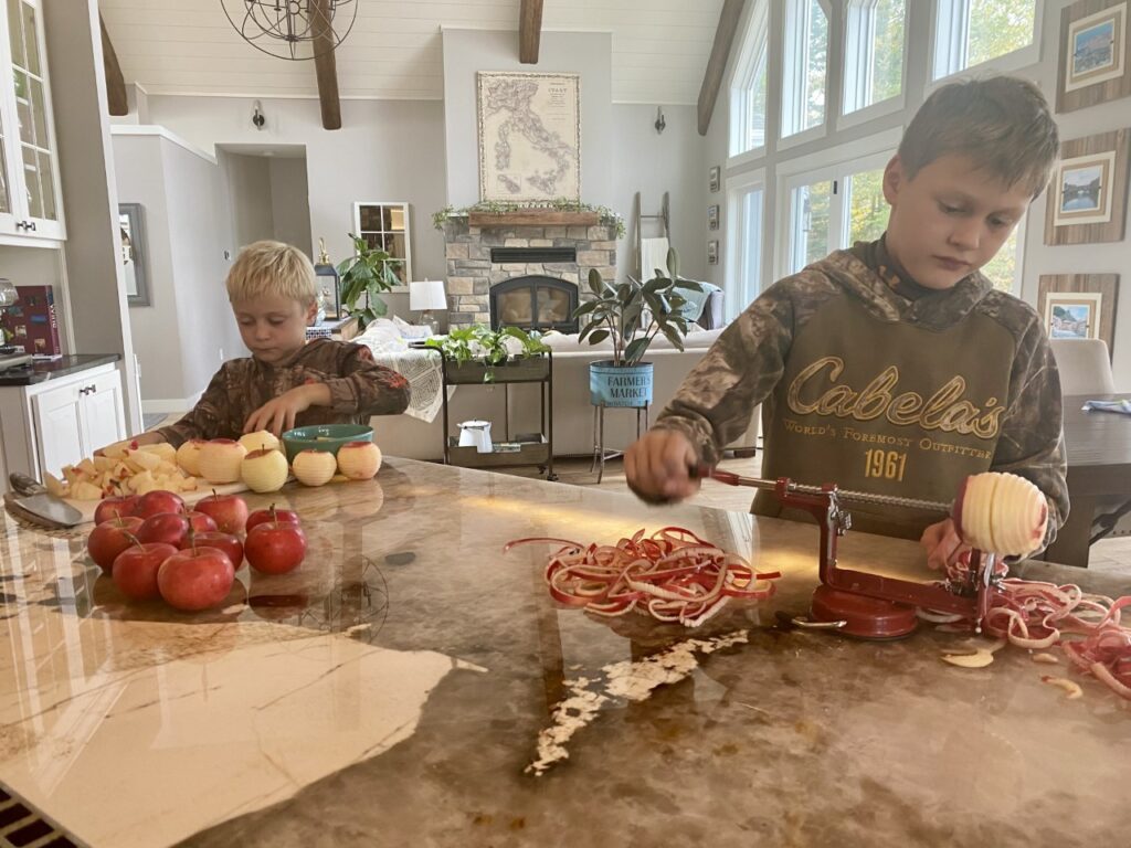 My oldest 2 sons are helping me peel and core the apples for our Spiced Apple Hand Pies. 