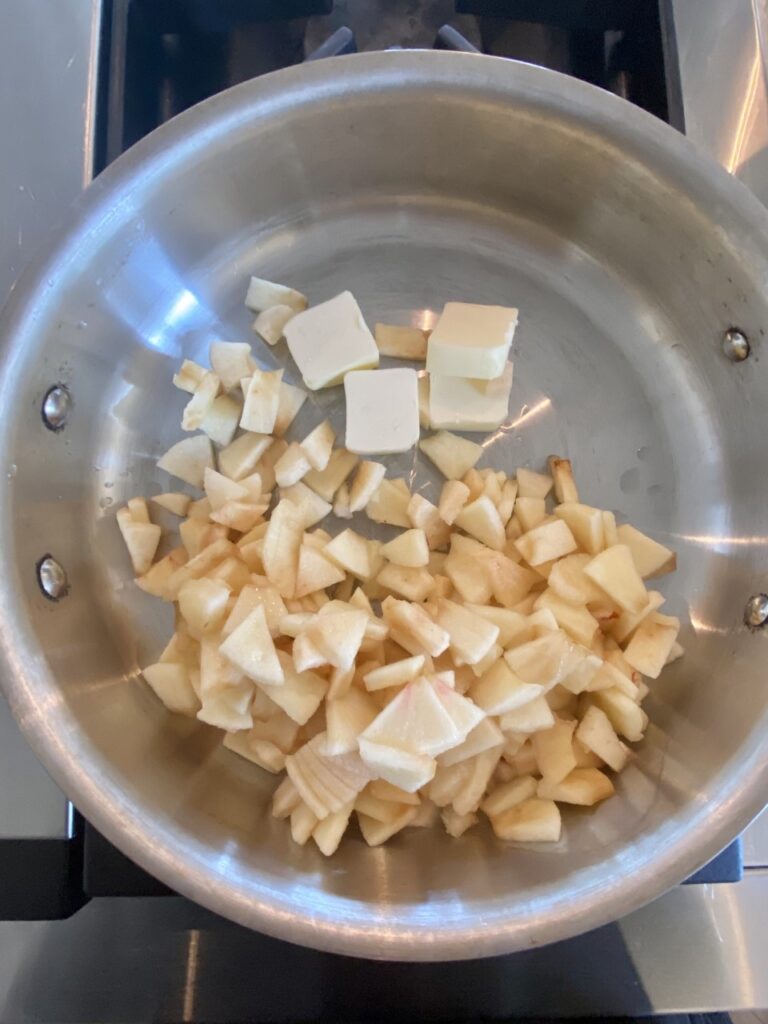 The Honeycrisp apples are diced and in the pan with the butter - Step 1. 