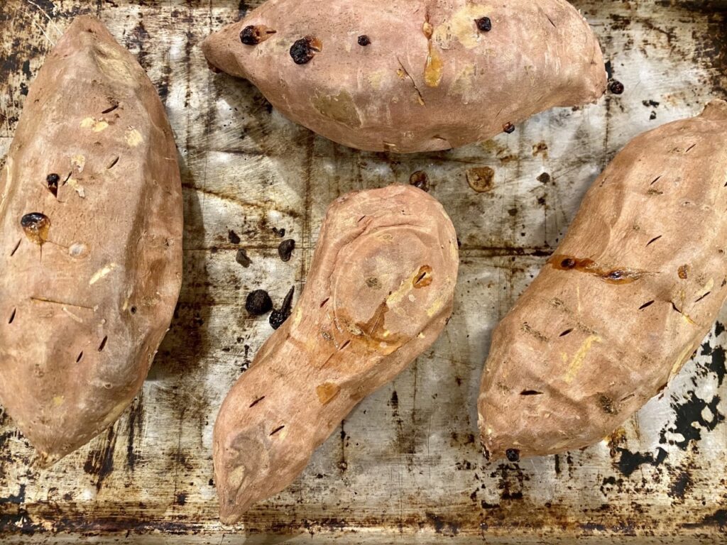 Roasted sweet potatoes with holes poked in are ready to cool & be mashed for this Maple Pecan Sweet Potato Streusel