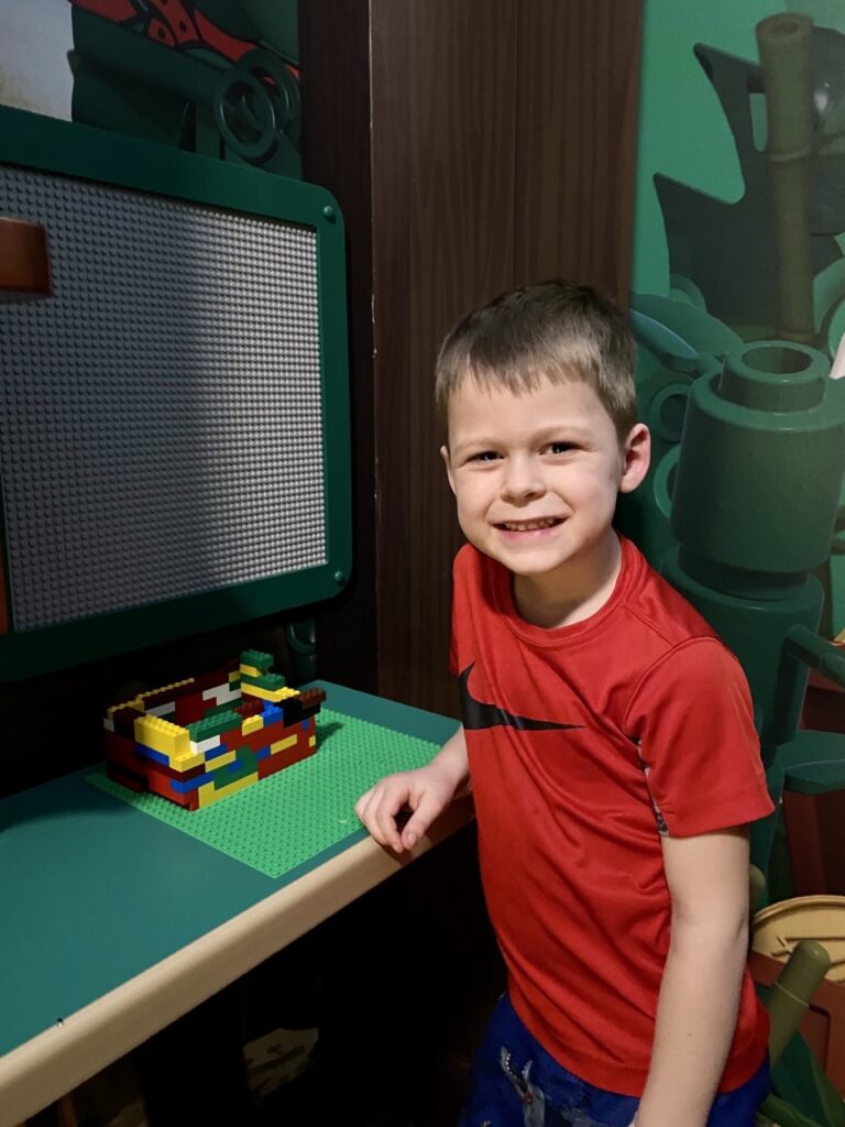 My youngest son creates awesome Lego creations in our own in-room building center at the Legoland Pirate Island Hotel