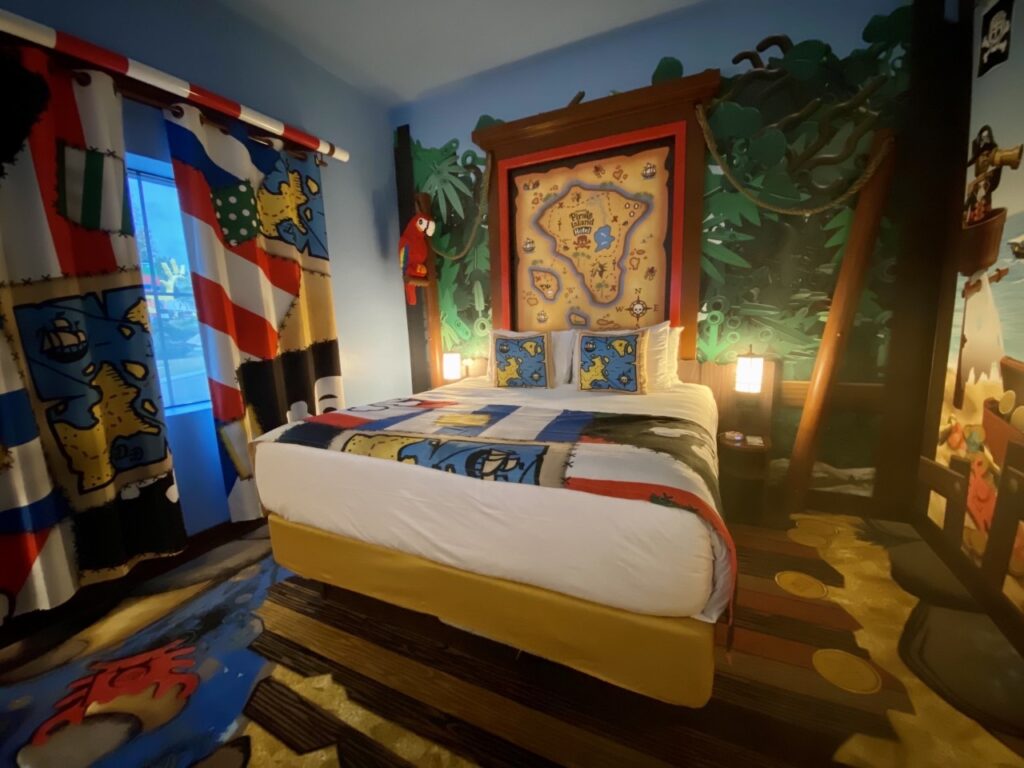 Generous King-sized bed area inside the Legoland Pirate Island guest rooms