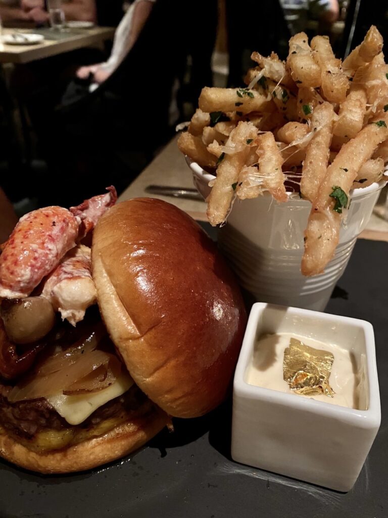 The Ultimate Burger served with lobster, truffle fries & yes, that's edible gold inside the aioli! Red Salt - Best of Kauai