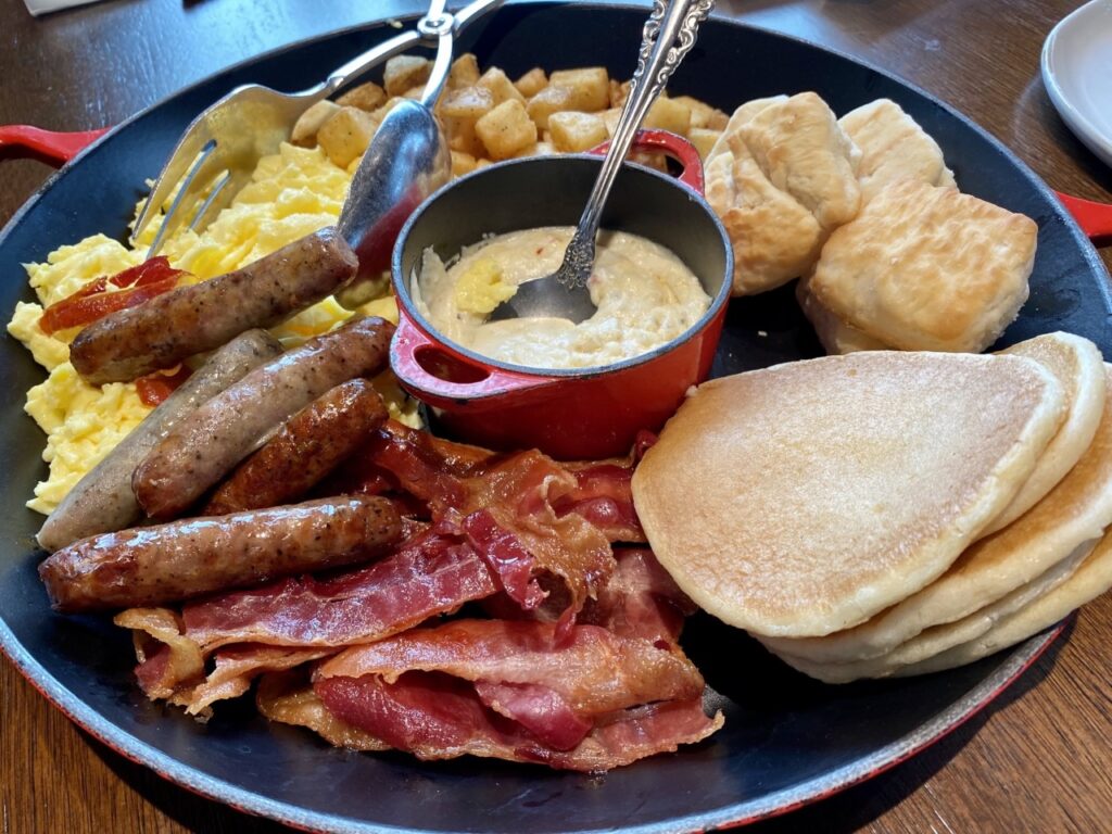 Large platters of food served family-style for breakfast at Shipwrecks Restaurant
