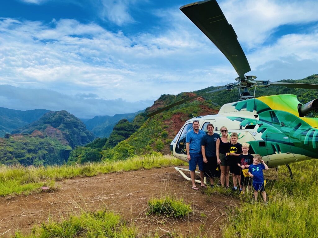 Family photo in front of the Safari Helicopter in the Waimea Canyon